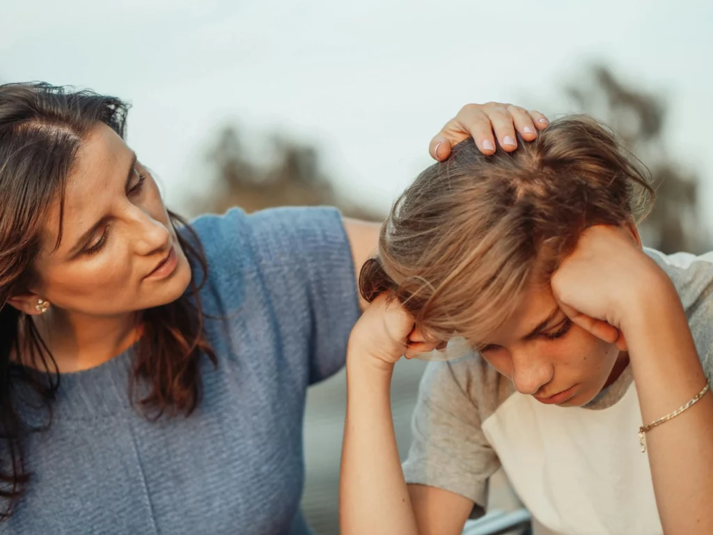 Woman teaching her emotional daughter's head while teaching her emotional intelligence