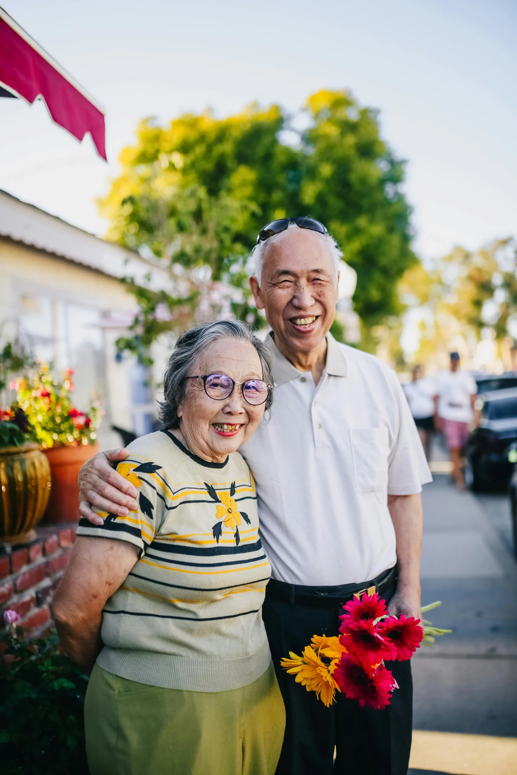 Happy aged couples holding each other closely and smiling