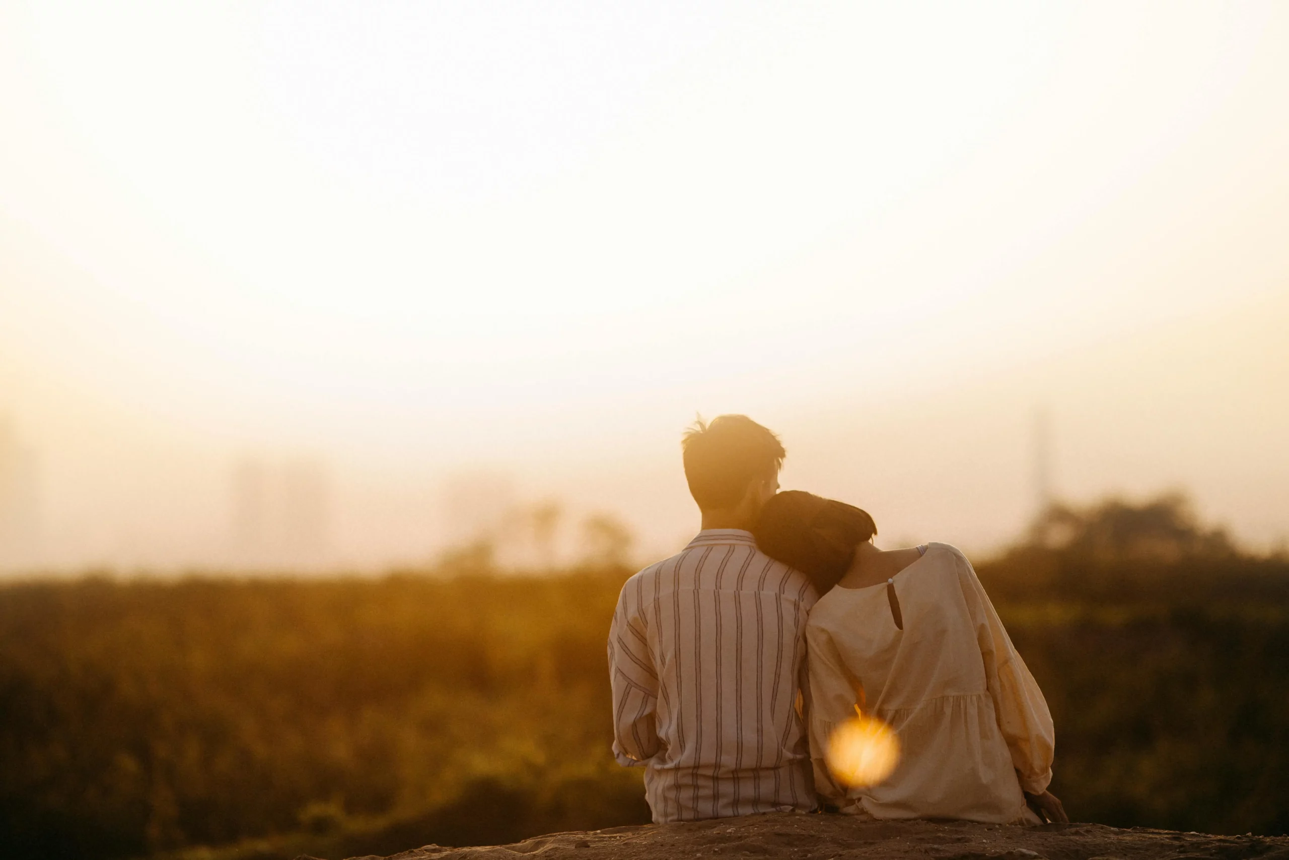 Couples in a lovely but Platonic Relationship, sitting and enjoying as the sun set on a mountain together