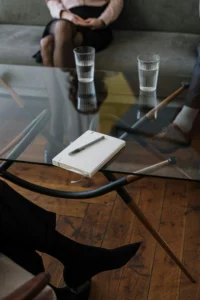 Divorce meeting in Texas. Glasses of water and a notebook used by the attorney for writing